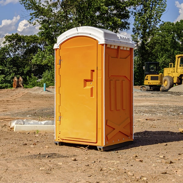 what is the cost difference between standard and deluxe portable restroom rentals in Guilford